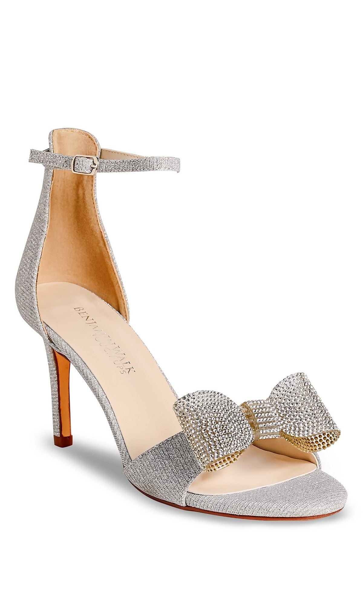 The Esme Silver Prom Shoes: Touch Ups 4744 feature a silver open-toe high heel sandal with an ankle strap, stiletto design, and decorative rhinestone bow—perfect dazzling heels for prom or any special occasion.